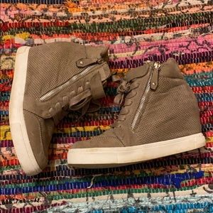 Worn once, heeled sneakers with two side zippers.